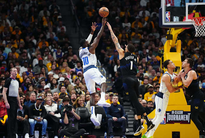 Mavs' Tim Hardaway Jr. shoots a fadeaway jumper over Nuggets' Michael Porter Jr.